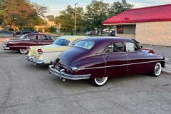 1949 Packard Deluxe Eight 4-Door Touring Sedan in Maroon and 1955 Clipper Custom 4-Door Touring Sedan in Yellow and White and 1953 Packard Patrician 4-Door Touring Sedan in Matador Maroon