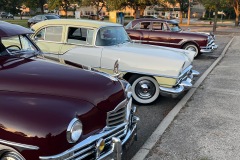 1949 Packard Deluxe Eight 4-Door Touring Sedan in Maroon and 1955 Clipper Custom 4-Door Touring Sedan in Yellow and White and 1953 Packard Patrician 4-Door Touring Sedan in Matador Maroon