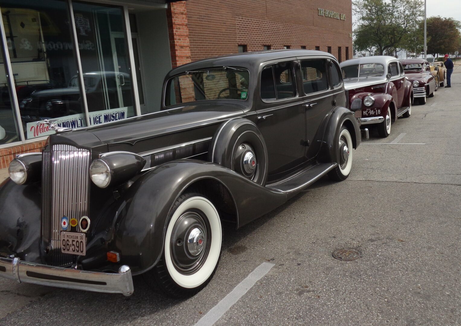 line of Packards next to a brick building in Port Huron, MI in 2014