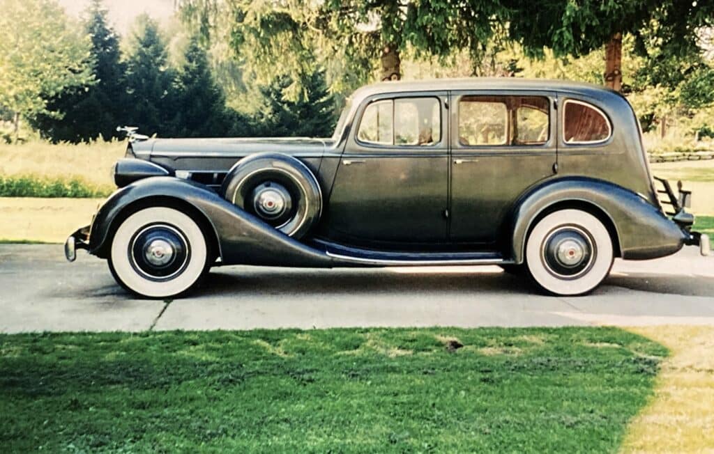 1936 Packard Model 1400 Eight Sedan on a driveway underneath a tree