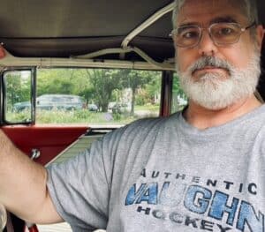 Kevin in his natural habitat: Behind the wheel of a Packard Caribbean.